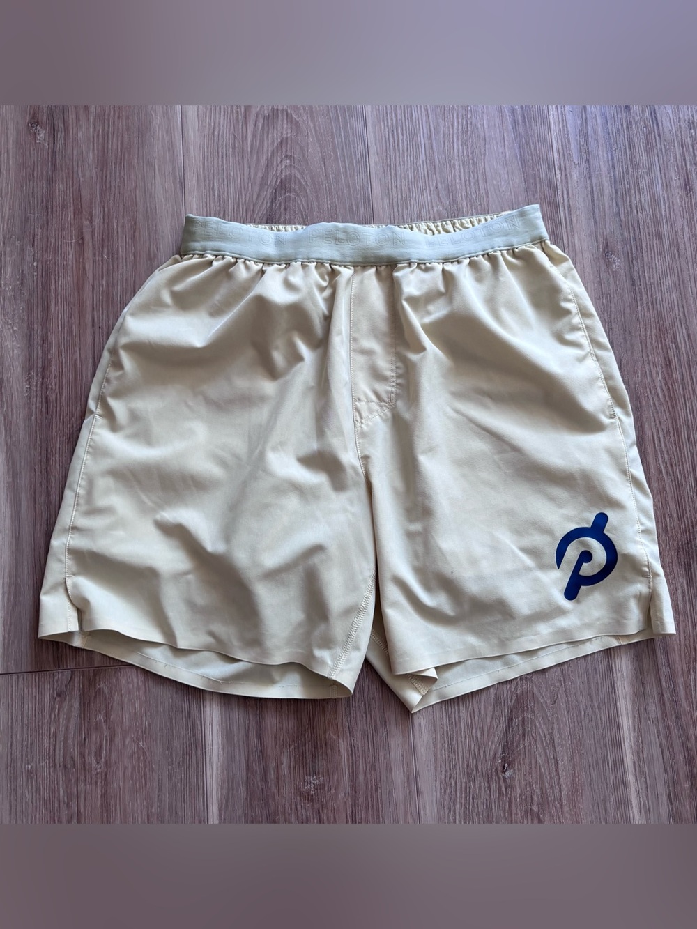 Peloton Pale Yellow Athletic Shorts with Navy Logo size M